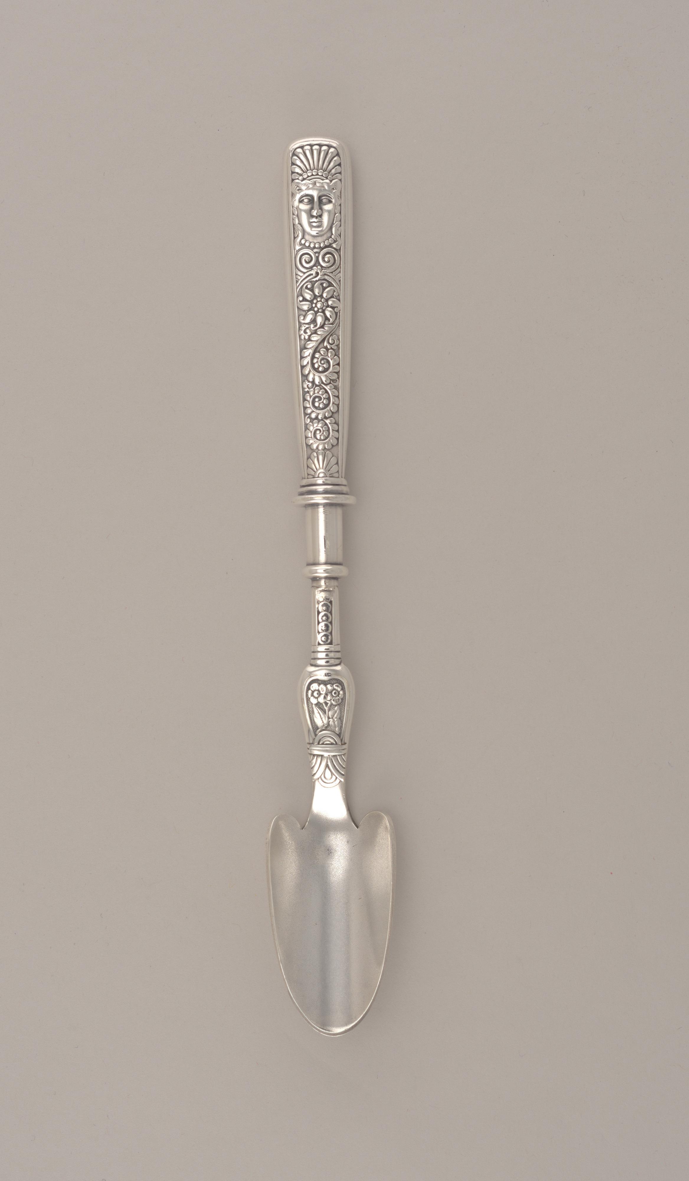 "Assyrian Head" Pattern Cheese Scoop