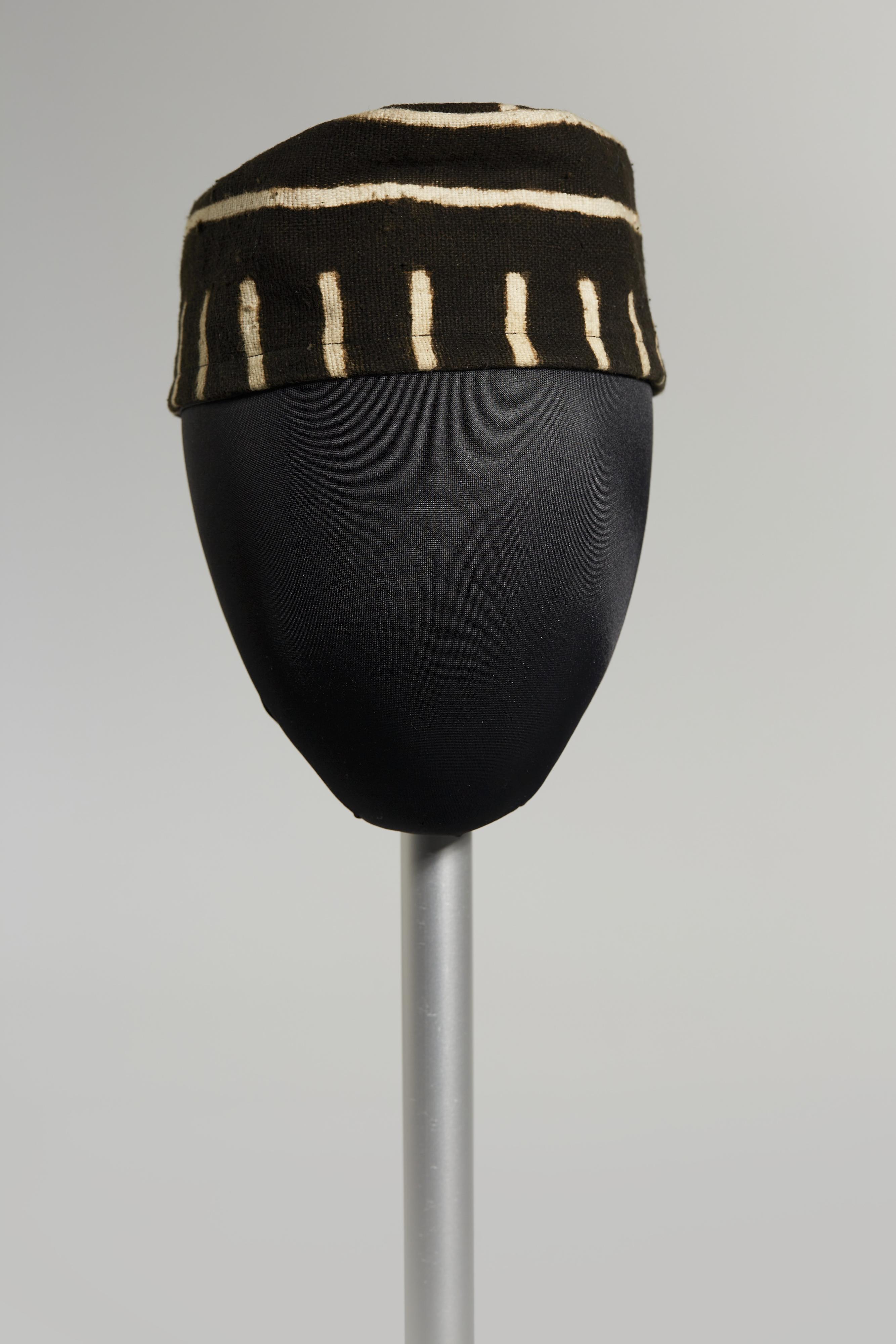Brown hat with white pattern