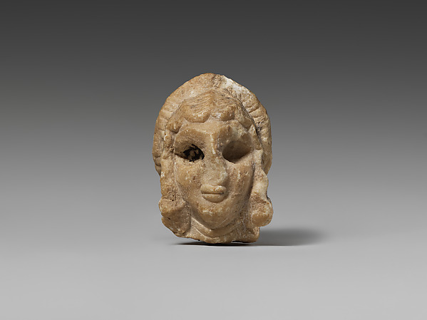 Female head with elaborate hairstyle