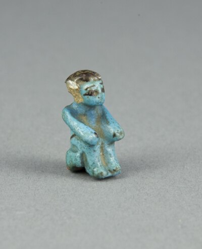 Figurine of a Seated Man