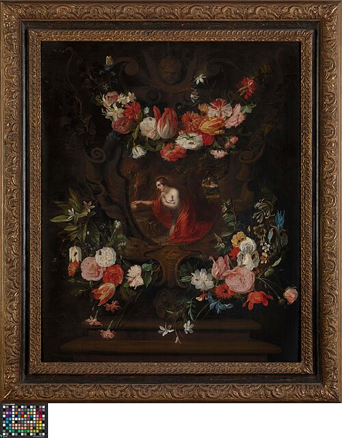 Flower wreath frames the virgin Mary