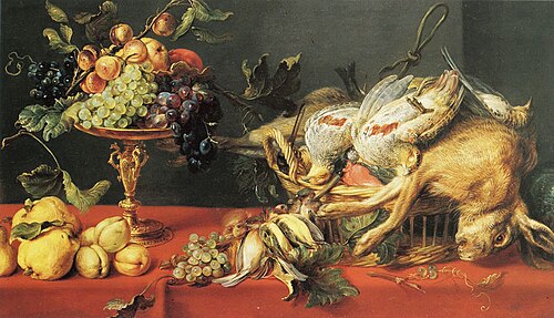 Game and fruit on a table