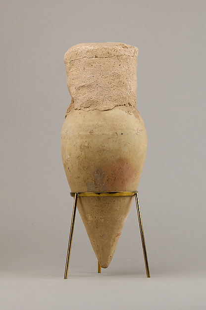 Jar with pointed base and intact seal