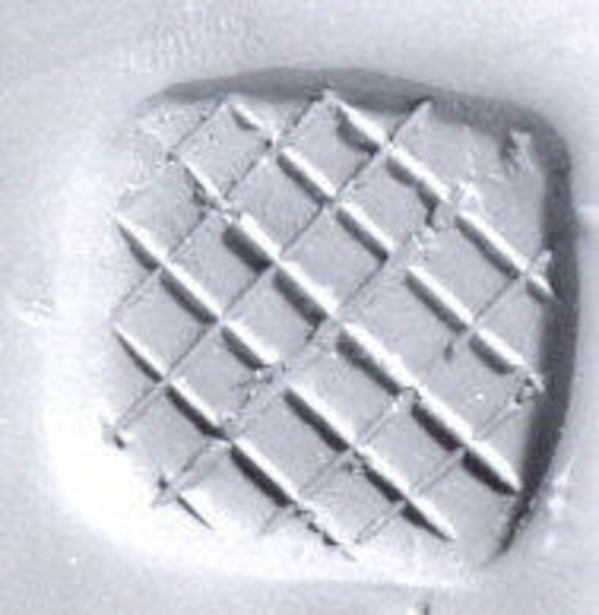 Loop (?) handled rectangular stamping device