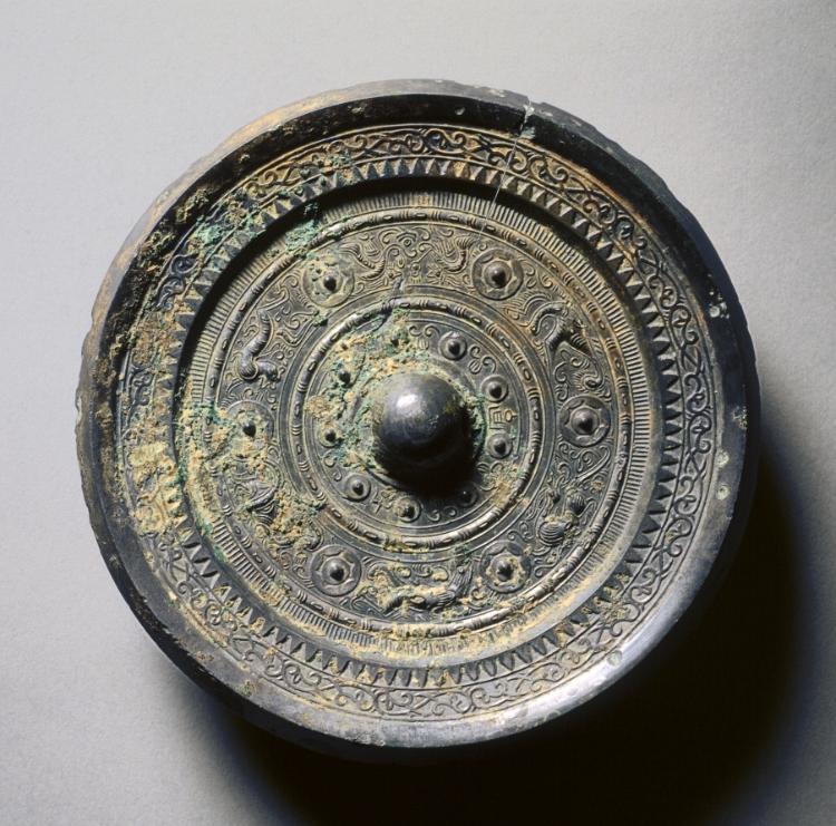 Mirror with Concentric Circles, an Immortal, and Auspicious Animals
