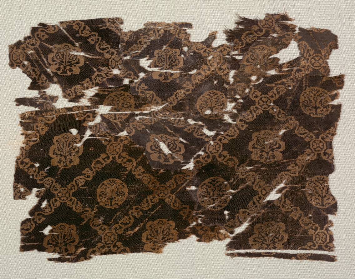 Silk with lattice of animals in medallions