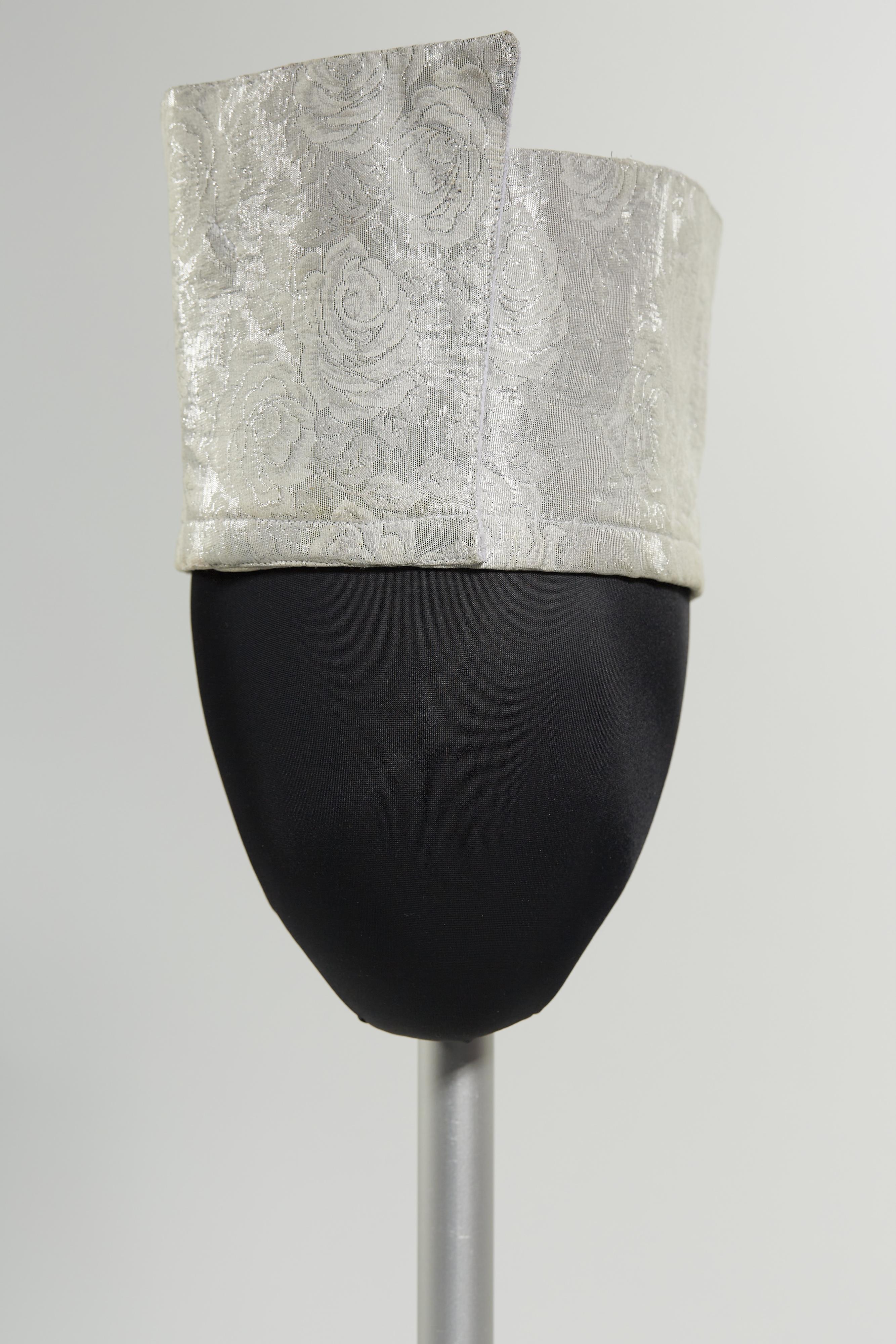 Silver crownless hat with floral pattern