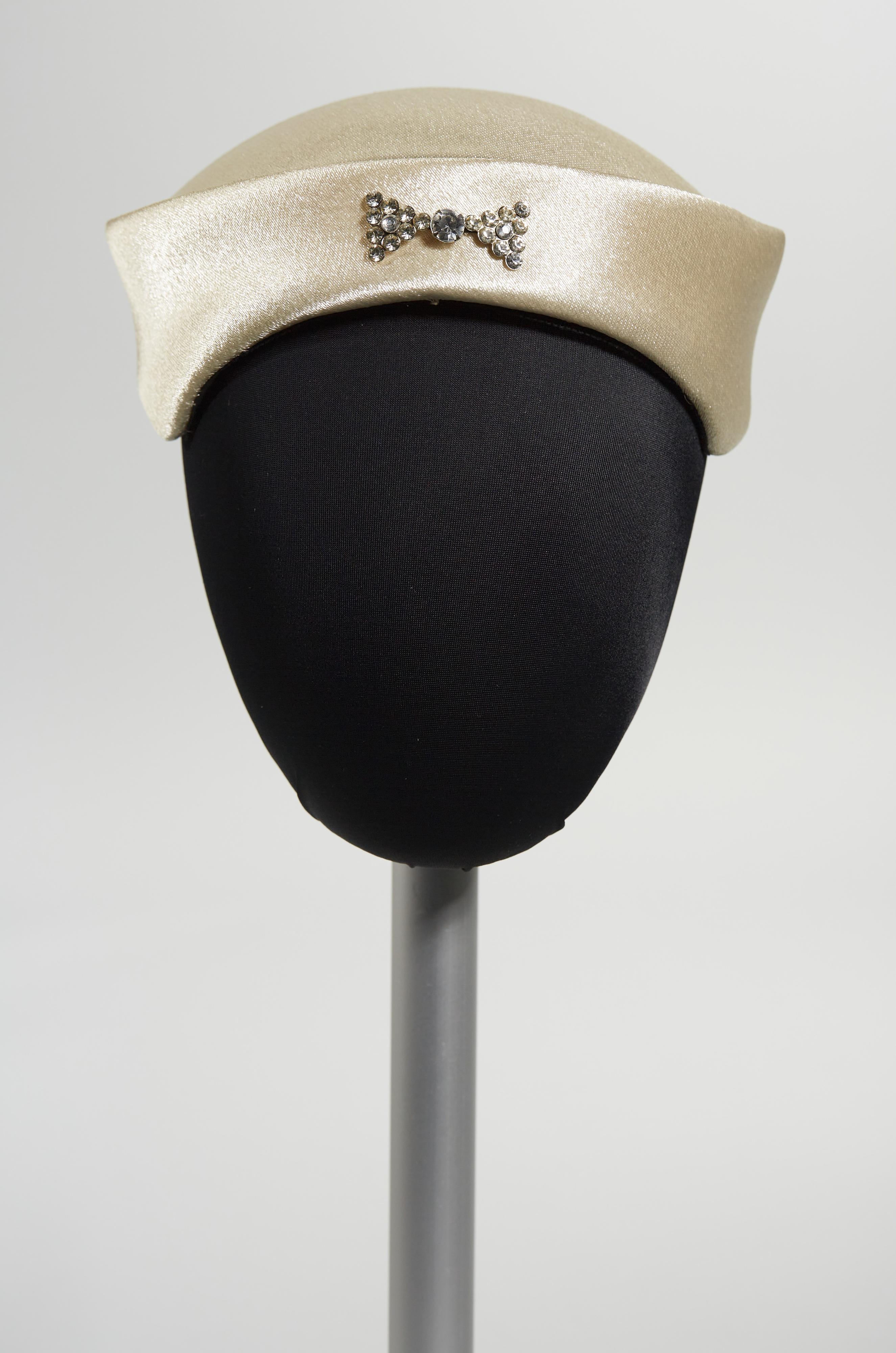 White hat with rhinestone bow